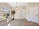 Cozy dining area with natural light and wood-look flooring at 5131 Gato Del Sol Cir, Wesley Chapel, FL 33544