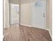 Welcoming foyer with wood-look flooring, leading to the rest of the home at 5131 Gato Del Sol Cir, Wesley Chapel, FL 33544