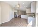 Modern kitchen features stainless steel appliances, granite countertops, and white cabinets at 5131 Gato Del Sol Cir, Wesley Chapel, FL 33544