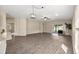 Open living room features wood floors, sliding glass doors to the backyard at 5131 Gato Del Sol Cir, Wesley Chapel, FL 33544