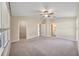 Spacious main bedroom features a ceiling fan, ensuite bathroom and walk-in closet at 5131 Gato Del Sol Cir, Wesley Chapel, FL 33544