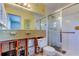 Bathroom with tiled shower and mirror at 565 55Th Ne Ave, St Petersburg, FL 33703