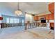 Spacious kitchen area with oak cabinets, a view to the entry door, and an unfinished design at 565 55Th Ne Ave, St Petersburg, FL 33703
