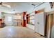 Bright laundry room features cabinets, shelving and washer and dryer hookups at 565 55Th Ne Ave, St Petersburg, FL 33703