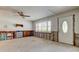 Living room with natural light from a large window, a ceiling fan and unfinished drywall at 565 55Th Ne Ave, St Petersburg, FL 33703