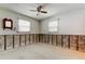 Room with bright windows and mounted mirror at 565 55Th Ne Ave, St Petersburg, FL 33703