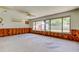 Large sunroom featuring big windows and access to the backyard, awaiting a personal remodel touch at 565 55Th Ne Ave, St Petersburg, FL 33703