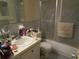 Bathroom featuring a vanity with white sink and a shower/tub with glass doors at 5970 21St N St # 15, St Petersburg, FL 33714