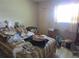 Bedroom with neutral walls and wood laminate flooring and a window for natural light at 5970 21St N St # 15, St Petersburg, FL 33714