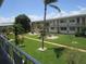 Courtyard showing landscaped lawns and mature trees, offering a tranquil outdoor living space at 5970 21St N St # 15, St Petersburg, FL 33714