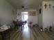 Spacious dining area with modern flooring and easy access to the kitchen and other living spaces at 5970 21St N St # 15, St Petersburg, FL 33714