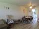 Inviting dining area with a ceiling fan, wood-look flooring, and a cozy table for Gathering meals at 5970 21St N St # 15, St Petersburg, FL 33714