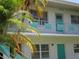Charming condo featuring a two-story layout with eye-catching turquoise trim and well-maintained landscaping at 5970 21St N St # 15, St Petersburg, FL 33714