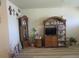 Charming living space featuring a curio cabinet, grandfather clock, and stylish, easy-to-maintain flooring at 5970 21St N St # 15, St Petersburg, FL 33714
