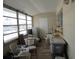 Enclosed sunroom featuring lots of natural light, a ceiling fan and wood laminate flooring at 5970 21St N St # 15, St Petersburg, FL 33714