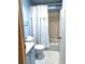 Cozy bathroom featuring a shower-tub combo, toilet and powder blue vanity sink at 6443 Midland St, Zephyrhills, FL 33542