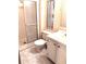 Bathroom featuring a shower stall, toilet, and vanity sink with floral wallpaper at 6443 Midland St, Zephyrhills, FL 33542