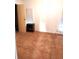 The cozy bedroom has a small storage cabinet and carpeting at 6443 Midland St, Zephyrhills, FL 33542