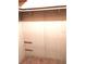 Walk-in closet featuring a carpeted floor and closet rod for storage at 6443 Midland St, Zephyrhills, FL 33542
