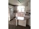 Bright eat-in kitchen features all-white cabinetry, countertops, and appliances at 6443 Midland St, Zephyrhills, FL 33542