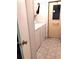 Laundry room with washer and dryer, tile floors, and an exterior door at 6443 Midland St, Zephyrhills, FL 33542