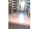 Unfinished storage room or workshop with shelving and a back door at 6443 Midland St, Zephyrhills, FL 33542