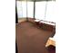 This sunny sunroom includes a bench and table seating area at 6443 Midland St, Zephyrhills, FL 33542