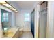 Bright bathroom with a tiled shower, large vanity, and natural light at 6605 Foxmoor Dr, Zephyrhills, FL 33542