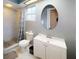 Modern bathroom with a shower, vanity, and stylish fixtures at 6605 Foxmoor Dr, Zephyrhills, FL 33542