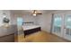 Bright main bedroom with carpet floors, ceiling fan, closet and access to outdoor at 6605 Foxmoor Dr, Zephyrhills, FL 33542