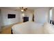 Spacious main bedroom features a ceiling fan, closet, and carpet floors at 6605 Foxmoor Dr, Zephyrhills, FL 33542
