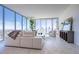Bright living room with floor-to-ceiling windows showcasing city views and contemporary furnishings at 777 3Rd N Ave # 1503, St Petersburg, FL 33701
