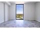 Bright bedroom featuring floor-to-ceiling windows offering expansive city views and stunning gray tiled floors at 777 3Rd N Ave # 1603, St Petersburg, FL 33701