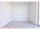 Bright bedroom featuring stunning gray tiled floors, base molding and white walls at 777 3Rd N Ave # 1603, St Petersburg, FL 33701