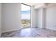 Bright bedroom featuring floor-to-ceiling windows offering expansive city views and stunning gray tiled floors at 777 3Rd N Ave # 1603, St Petersburg, FL 33701