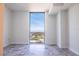 Bright bedroom featuring floor-to-ceiling windows offering expansive city views and stunning gray tiled floors at 777 3Rd N Ave # 1603, St Petersburg, FL 33701