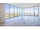 Spacious living room with large windows and marble-like tile flooring at 777 3Rd N Ave # 1603, St Petersburg, FL 33701