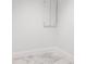 Small white room with gray tiled floors, base molding, and a white cabinet on the wall at 777 3Rd N Ave # 1603, St Petersburg, FL 33701
