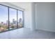Bright bedroom with marble floors and floor-to-ceiling windows with cityscape views at 777 3Rd N Ave # 1704, St Petersburg, FL 33701