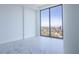 Bright bedroom with marble floors and floor-to-ceiling windows with cityscape views at 777 3Rd N Ave # 1704, St Petersburg, FL 33701