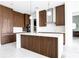 Modern kitchen featuring dark wood cabinets, quartz countertops, and pendant lighting at 777 3Rd N Ave # 1704, St Petersburg, FL 33701