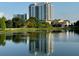 A picturesque view of the building from across the serene lake at 777 3Rd N Ave # 1704, St Petersburg, FL 33701