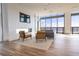 Living area with a fireplace, modern chairs, and floor to ceiling windows that provide a great view at 777 3Rd N Ave # 1704, St Petersburg, FL 33701