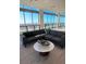 Bright lounge area with comfortable gray couches and panoramic city views from the large windows at 777 3Rd N Ave # 1704, St Petersburg, FL 33701