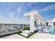 A rooftop pool deck with palm trees and covered seating areas offers city views at 777 3Rd N Ave # 1704, St Petersburg, FL 33701