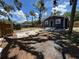 Discover a partially fenced backyard space, perfect for outdoor relaxation at 8018 Mulberry St, Tampa, FL 33604