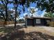 Featuring an inviting backyard, partially fenced for privacy at 8018 Mulberry St, Tampa, FL 33604
