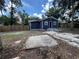 Cozy home featuring a fenced backyard, inviting outdoor relaxation and privacy for homeowners at 8018 Mulberry St, Tampa, FL 33604