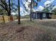 Backyard featuring a wooden fence, offering a private outdoor space at 8018 Mulberry St, Tampa, FL 33604