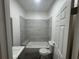 Modern bathroom with tiled shower and updated vanity at 8018 Mulberry St, Tampa, FL 33604